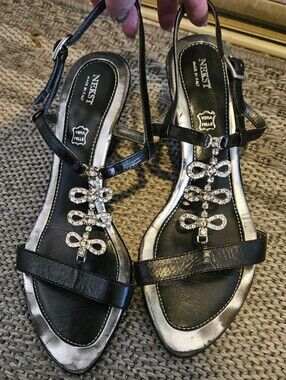 Nekst leather sandals with a rhinestone-accented T-strap. 38/8